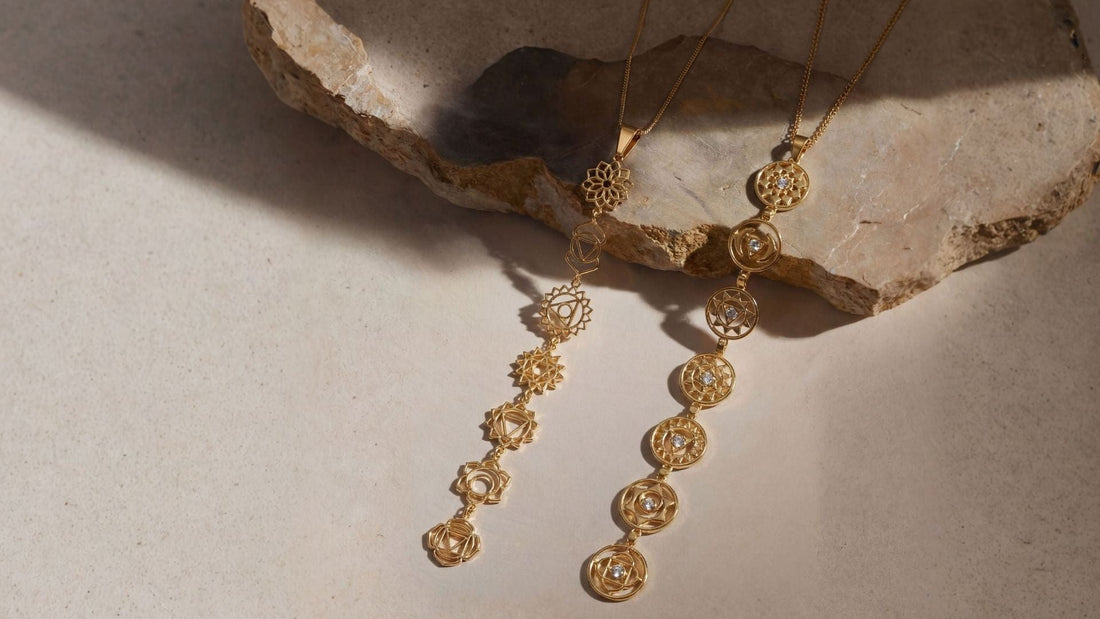 7-Chakra Necklace product flat lay on stone